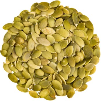 Image shows a circle of organic sprouted pumpkin seeds on a white background