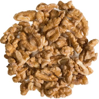 Image shows a circle of dry farmed organic sprouted walnuts on a white background.