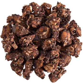 Image shows a small circle of dark brown nut clusters covered in chocolate on a white background