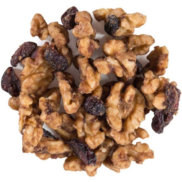 Image shows a small circle of walnuts and cranberries clusters on a white background