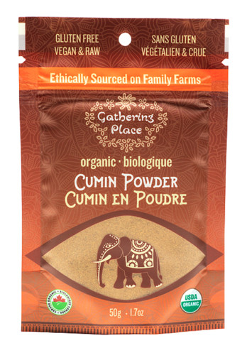 Image shows a small red/brown bag with a clear window at the bottom on a white background. Clear window shows a light brown powder and has an image of an elephant on top