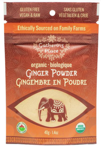 Image shows a brown/red bag with a clear window at the bottom on a white background. Window shows a light beige powder and al elephant on top
