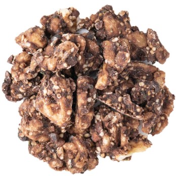 Image shows a circle of dark brown walnuts mixed with hemp seeds coated in cocoa powder chunks on a white background.